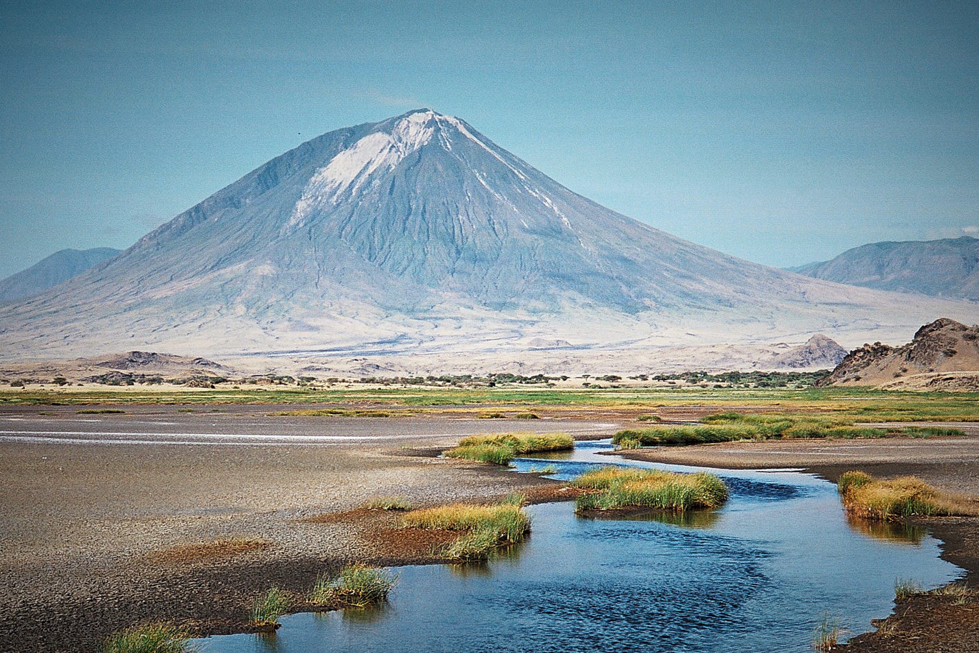 Locally known as the “Sacred Mountain of God” in the Maasai Language, Mount Ol Doinyo Lengai is an active volcano located south of Lake Natron in North Tanzania’s eastern rift valley.